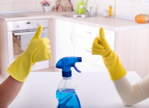 After builders cleaning team removing dust from a renovated room