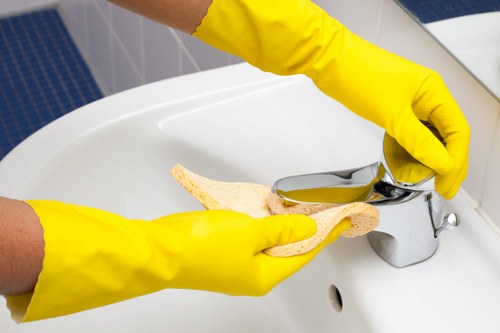 Cleaner disinfecting high-touch surfaces in a shared lobby